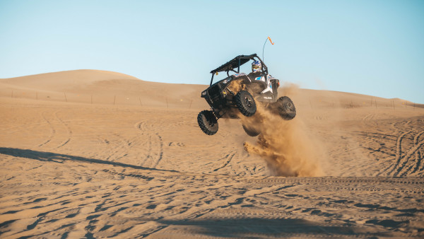With ATV on the the sand dunes