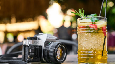 Retro photo camera and one cold drink