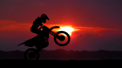 Biker on motorcycle at sunrise