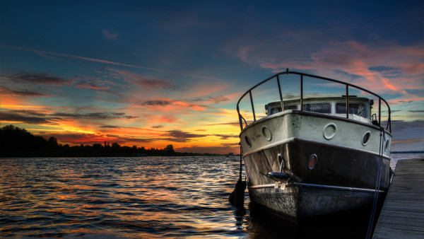 Boat and sunset in background
