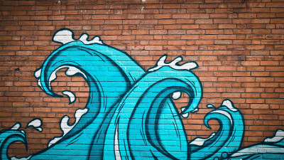 Graffiti waves on brick wall