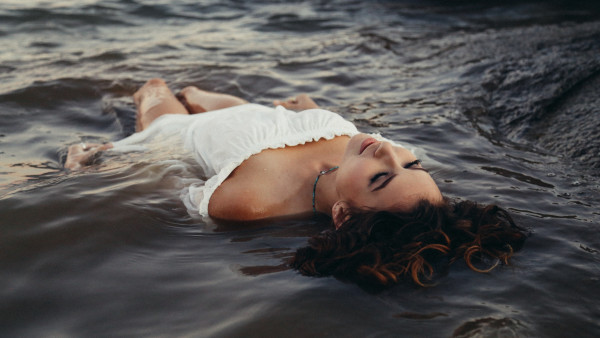 Sleeping beauty floating on water