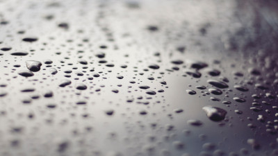 Raindrops on a metallic surface