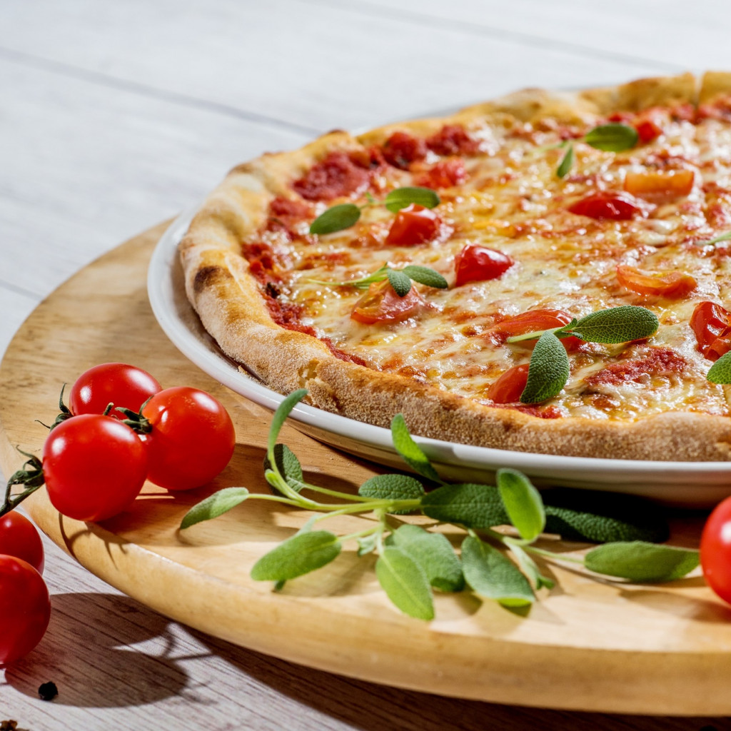 Pizza with cheese and tomatoes wallpaper 1024x1024