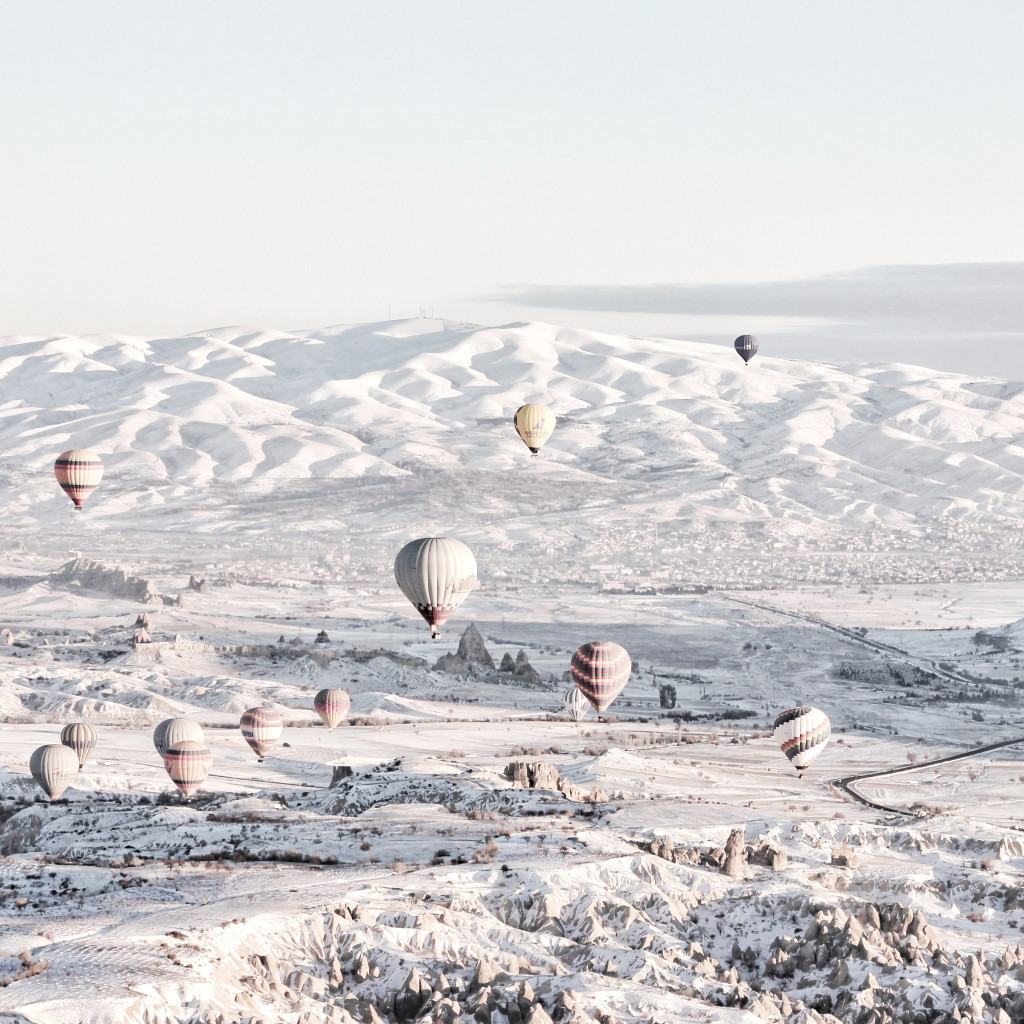 Hot air balloons in Winter landscape wallpaper 1024x1024
