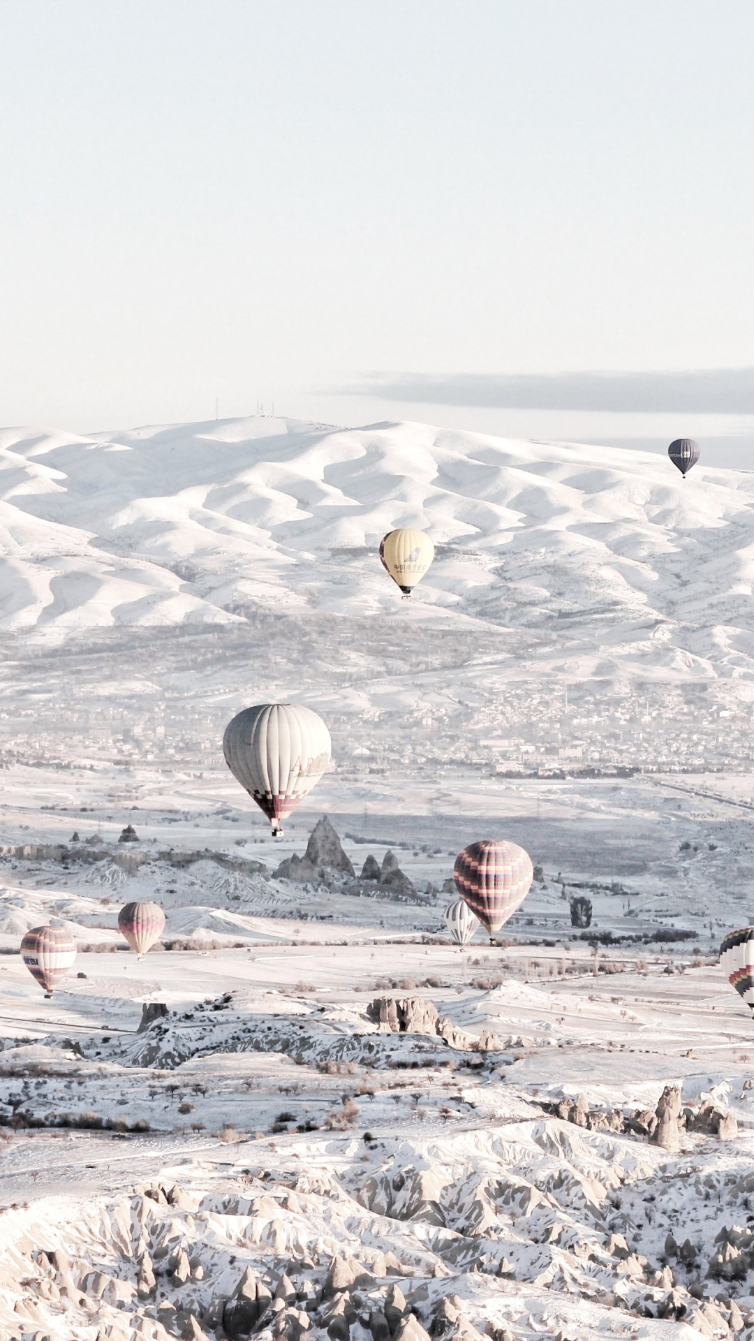 Hot air balloons in Winter landscape wallpaper 1080x1920