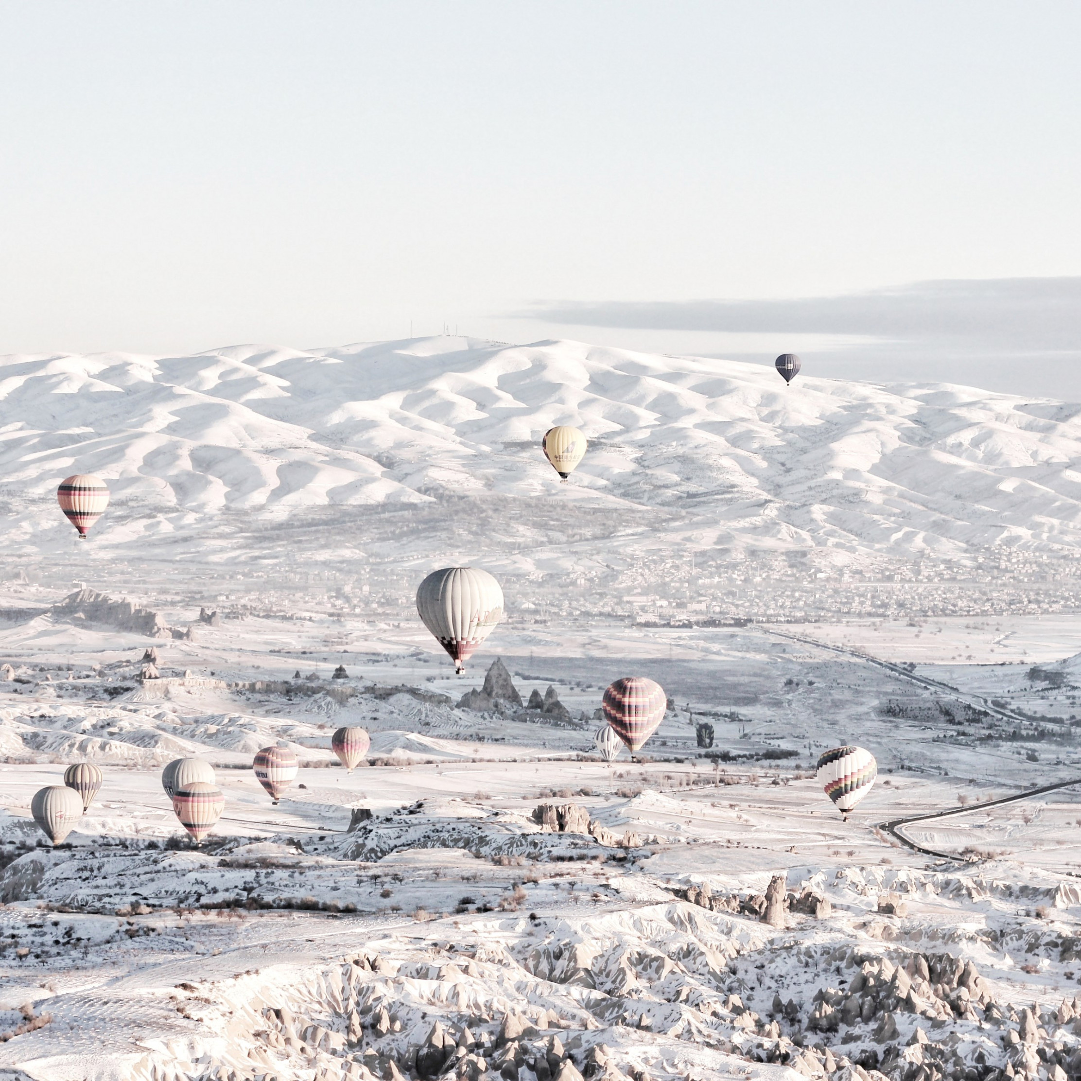 Hot air balloons in Winter landscape wallpaper 2224x2224