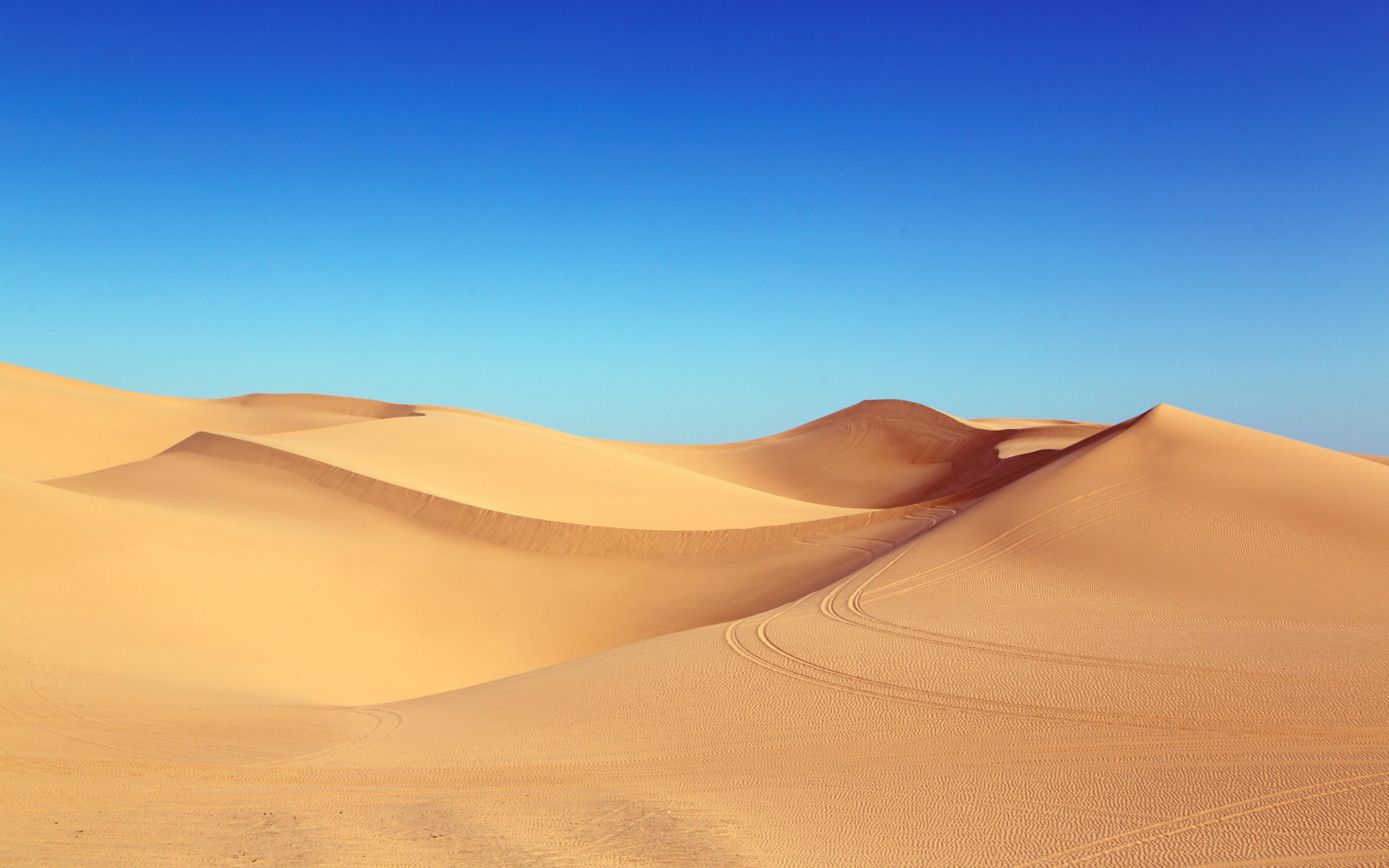 Blue sky and desert dunes wallpaper 1680x1050