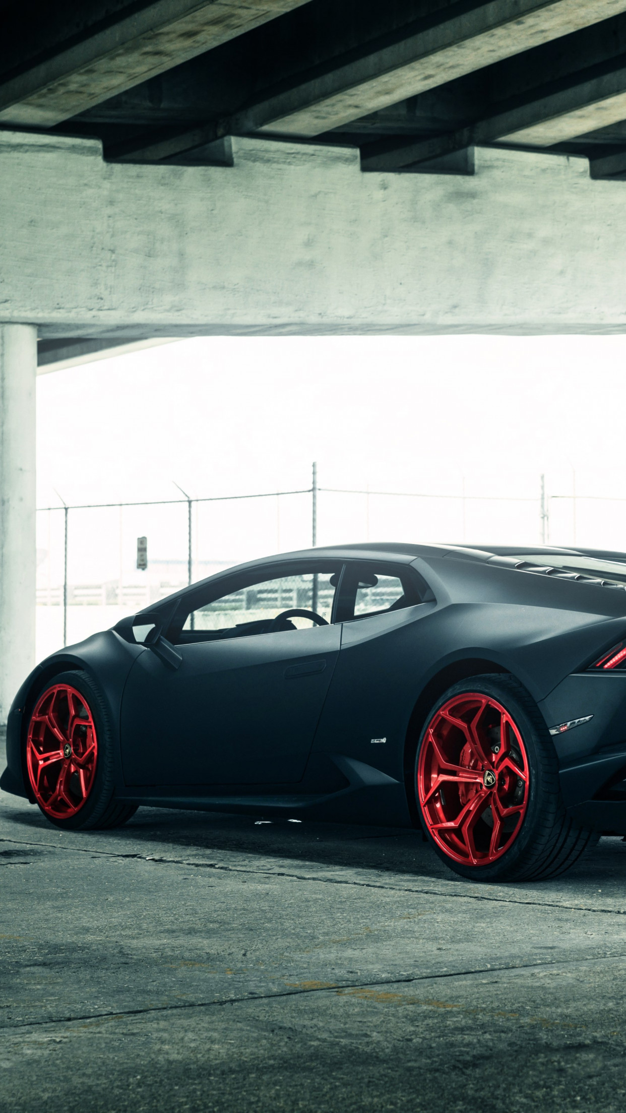 Vellano Matte Black Lamborghini Huracan on Red 3 wallpaper 1242x2208
