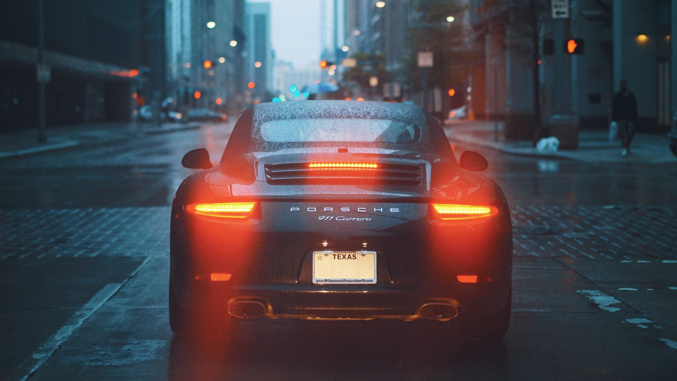 Porsche 911 Carrera on rainy streets wallpaper 2560x1440