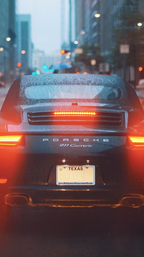 Porsche 911 Carrera on rainy streets wallpaper 480x854