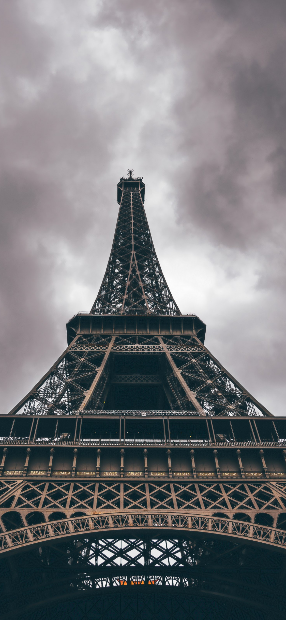 Eiffel Tower in a cloudy day wallpaper 1125x2436