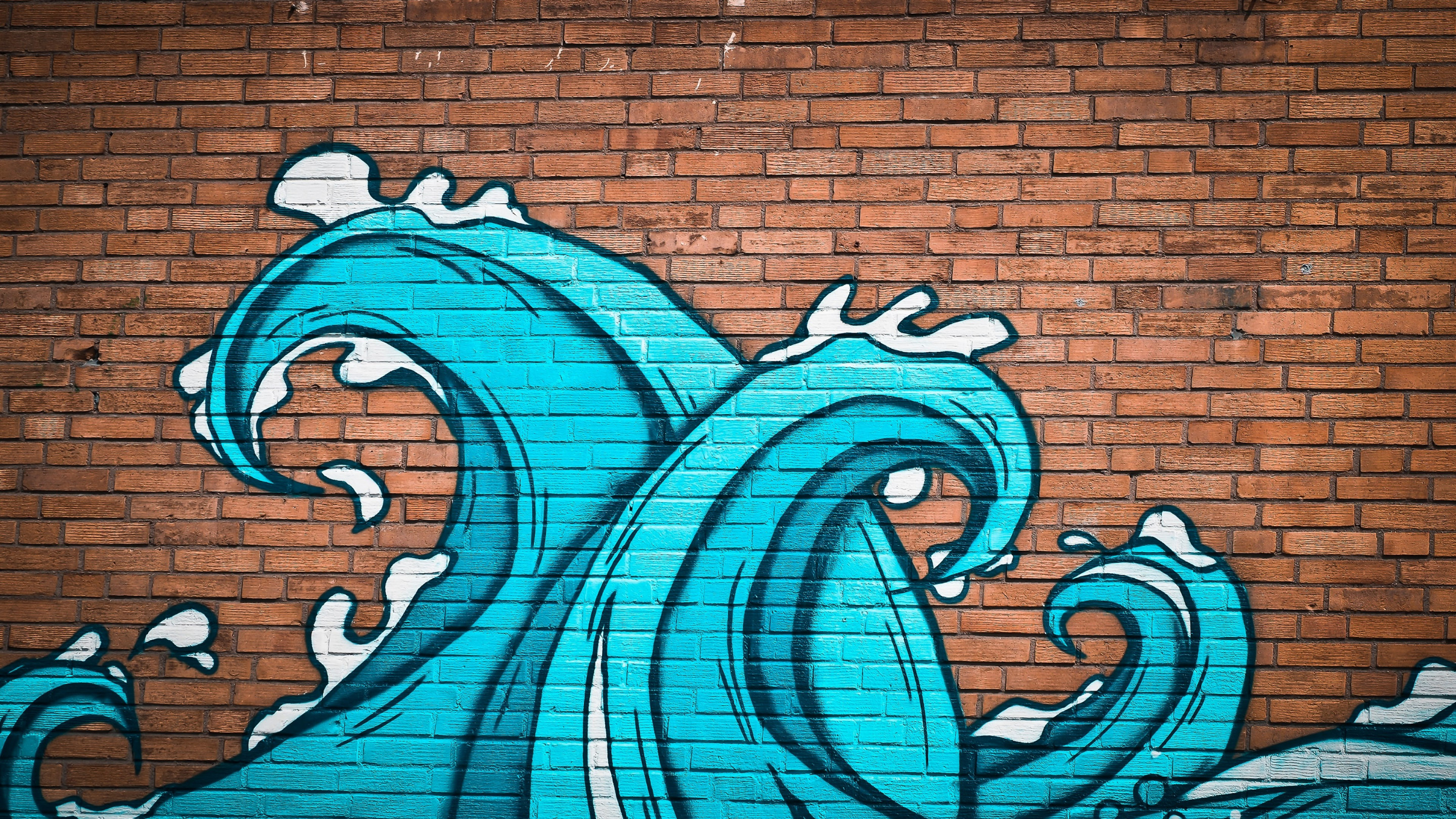 Graffiti waves on brick wall wallpaper 2880x1620