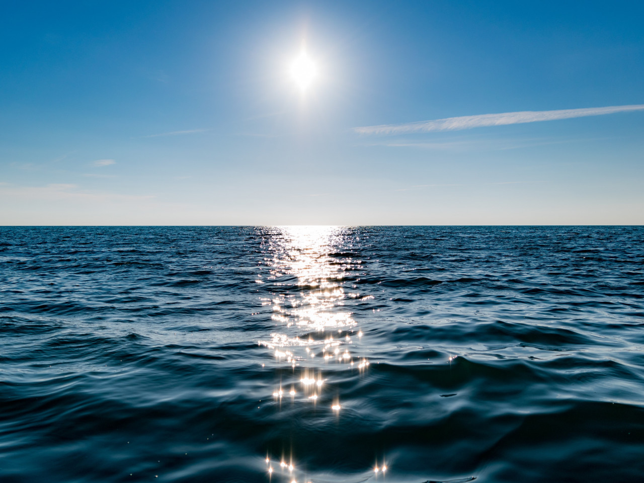 Sun on blue sky is reflected on water wallpaper 1280x960