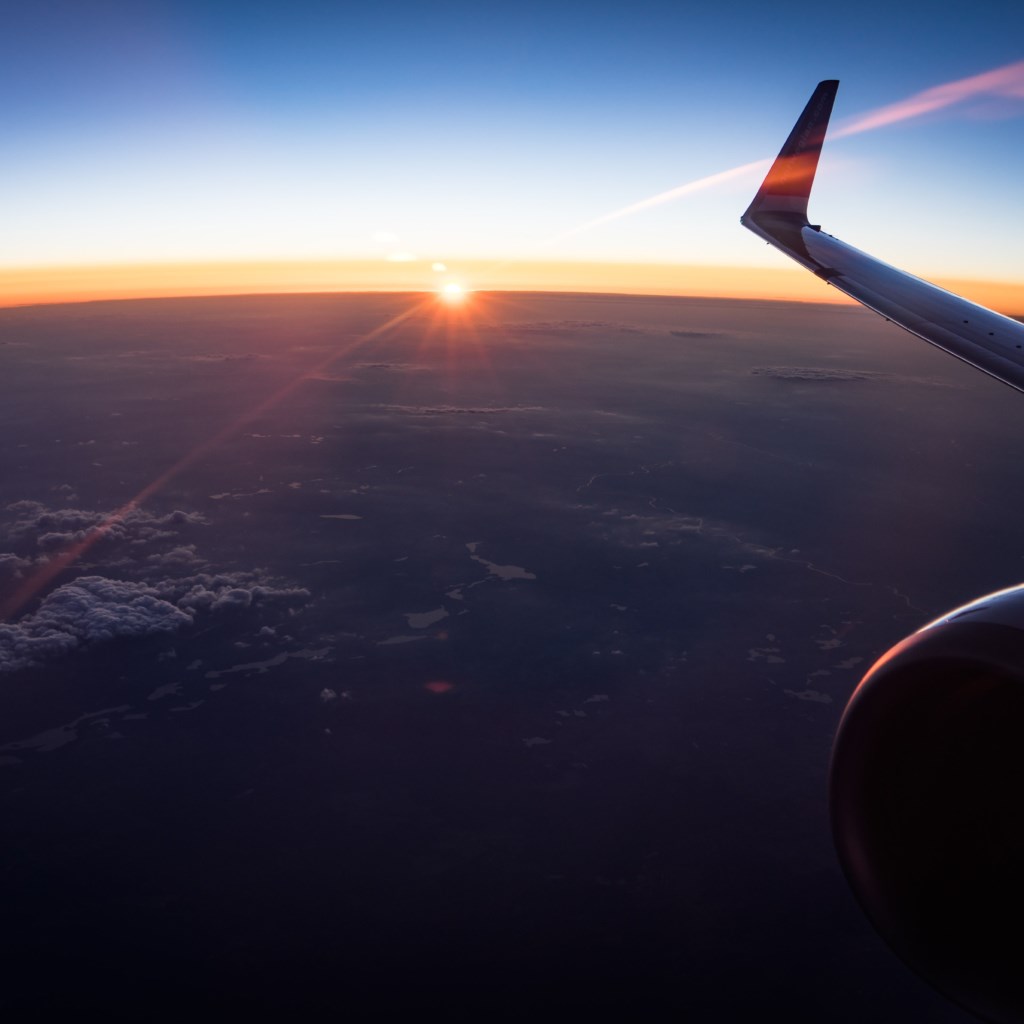 In the plane watching the sunset wallpaper 1024x1024
