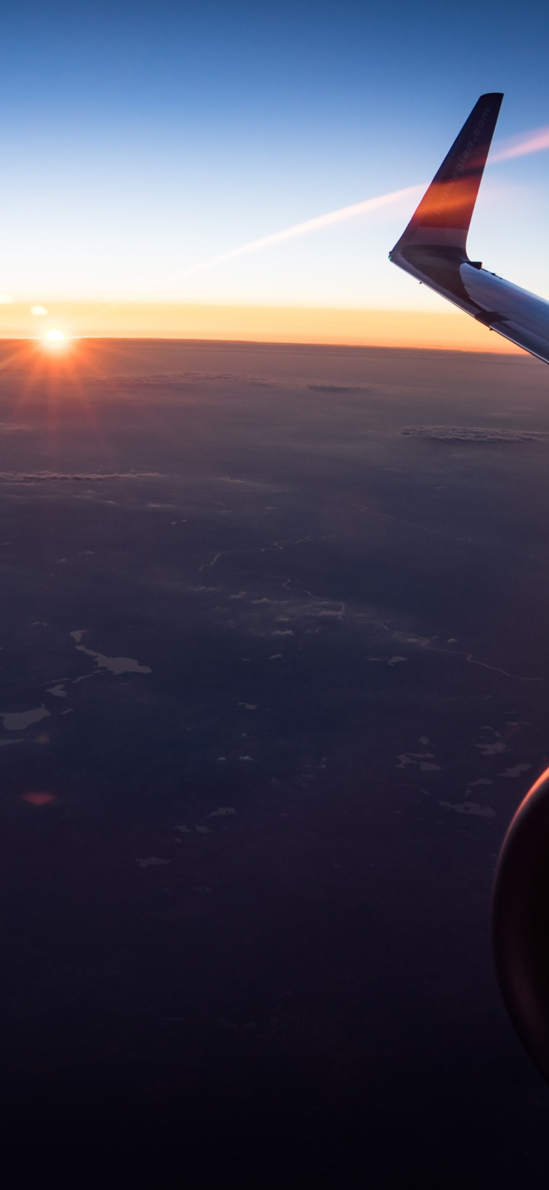 In the plane watching the sunset wallpaper 1125x2436