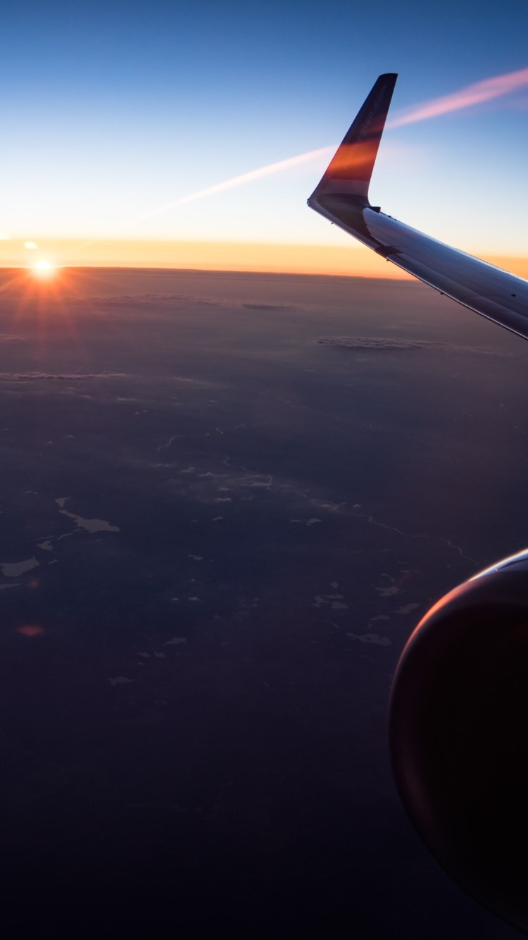 In the plane watching the sunset wallpaper 750x1334