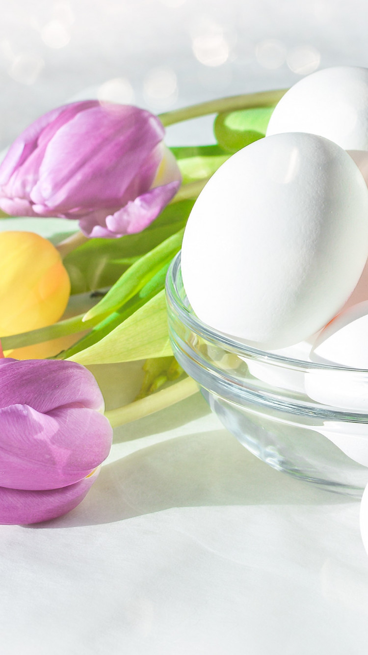 Easter eggs and beautiful tulips wallpaper 750x1334