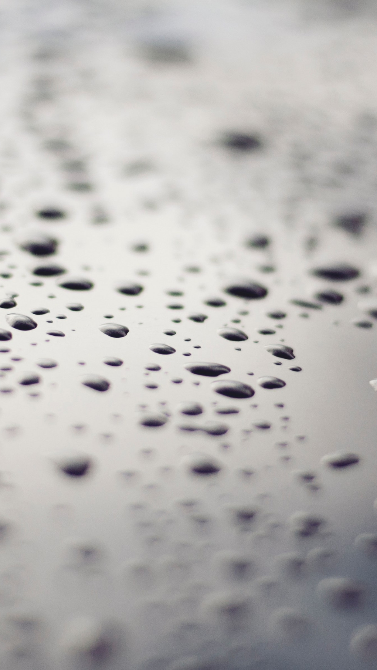 Raindrops on a metallic surface wallpaper 1242x2208