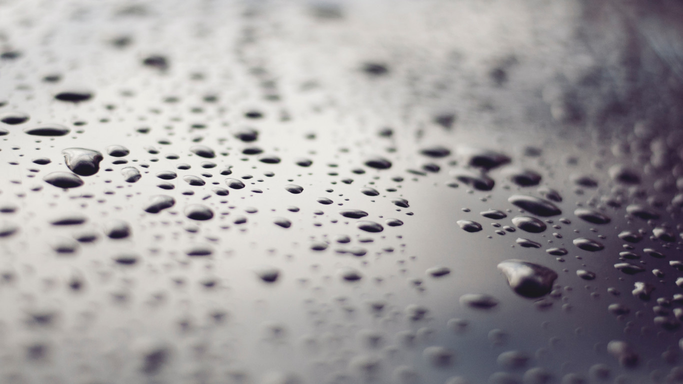 Raindrops on a metallic surface wallpaper 1366x768