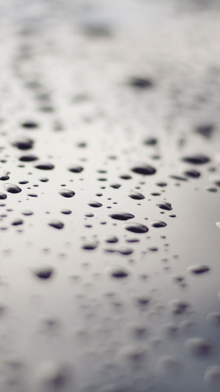 Raindrops on a metallic surface wallpaper 750x1334