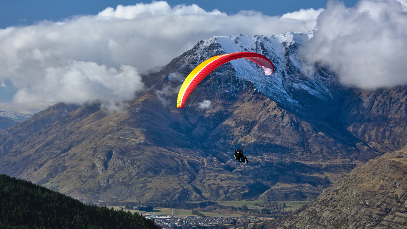 Paraglider up in the sky wallpaper 1366x768