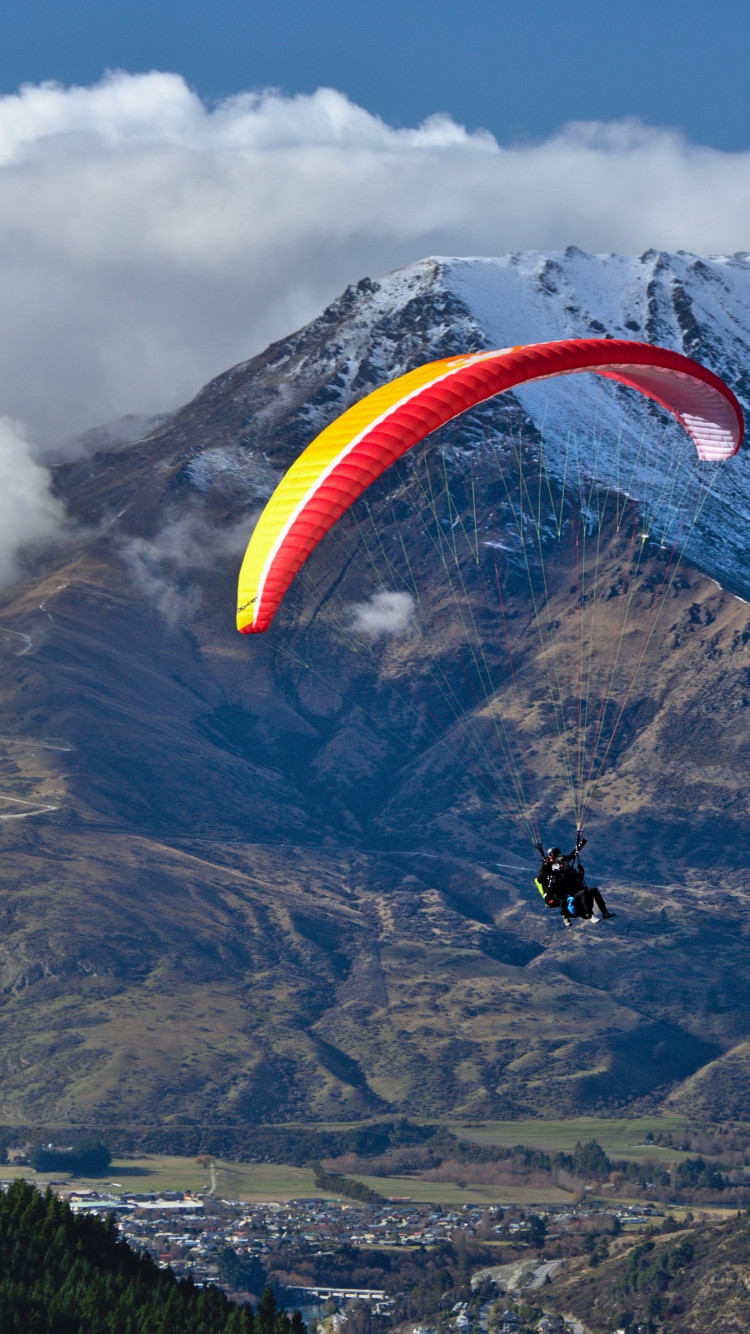 Paraglider up in the sky wallpaper 750x1334