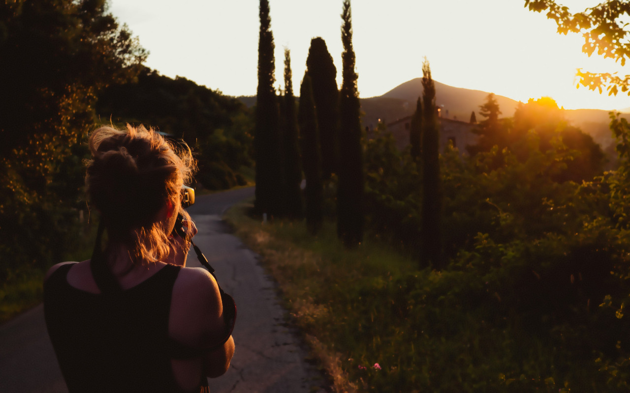 Girl taking pictures at sunset wallpaper 1280x800