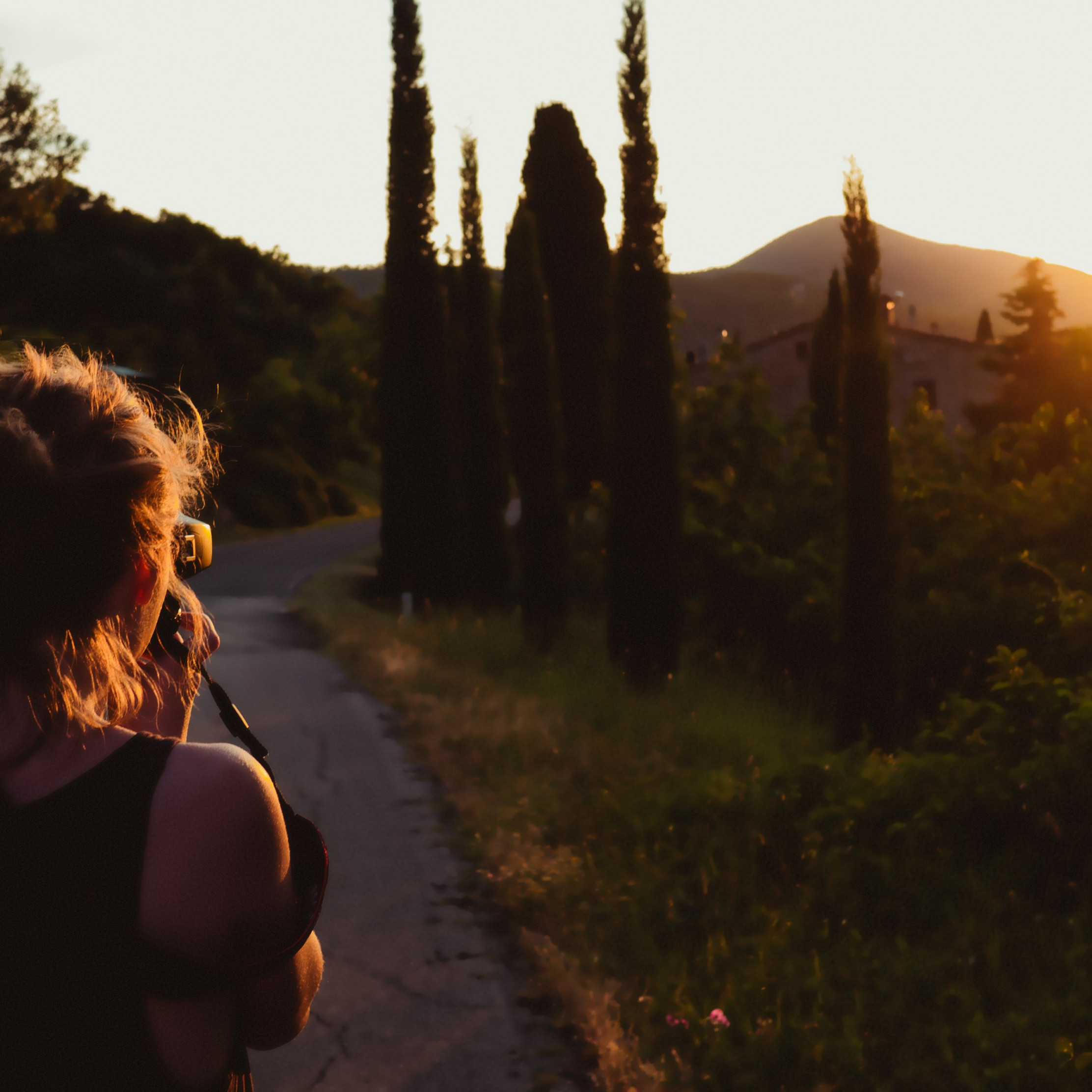 Girl taking pictures at sunset wallpaper 2224x2224