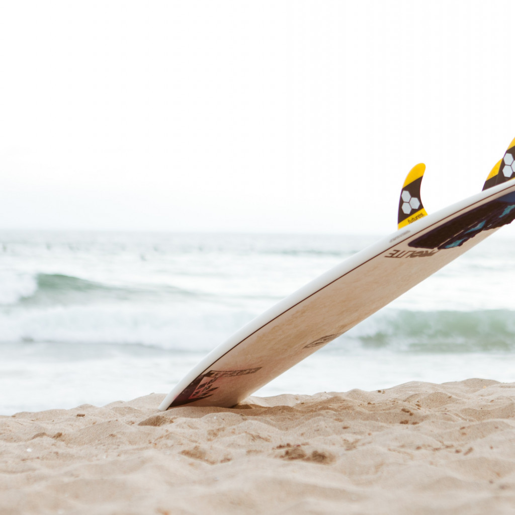 Surf board on the beach wallpaper 1024x1024