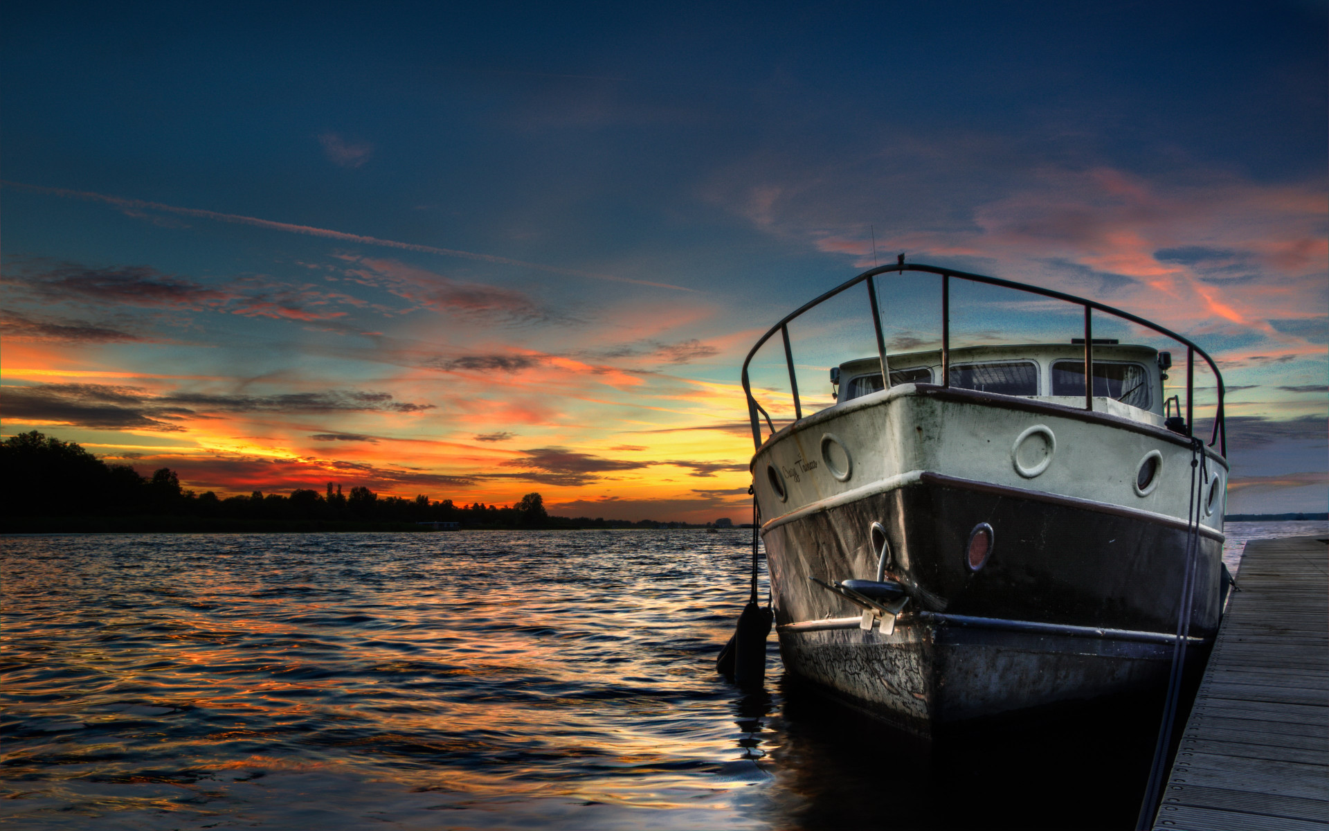 Boat and sunset in background wallpaper 1920x1200