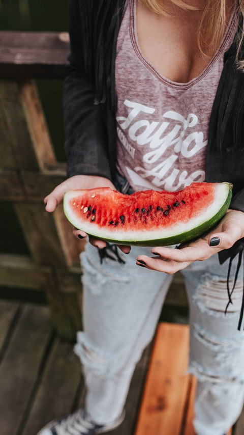 The girl with a watermelon slice wallpaper 480x854