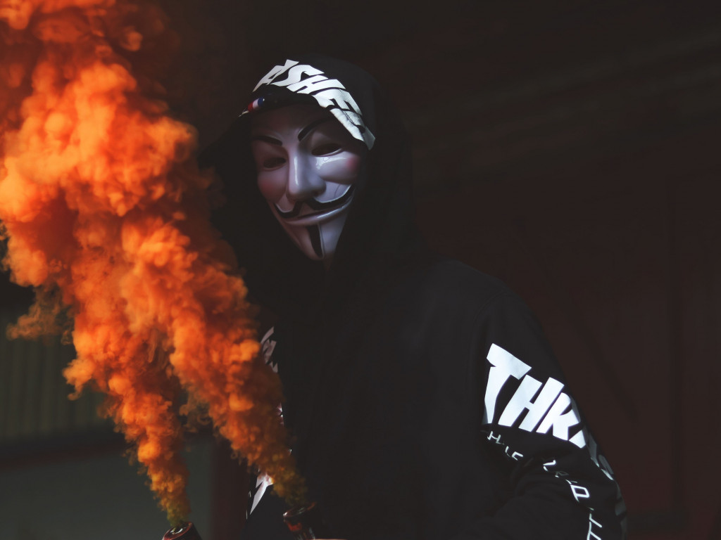 Anonymous mask and orange smoke wallpaper 1024x768