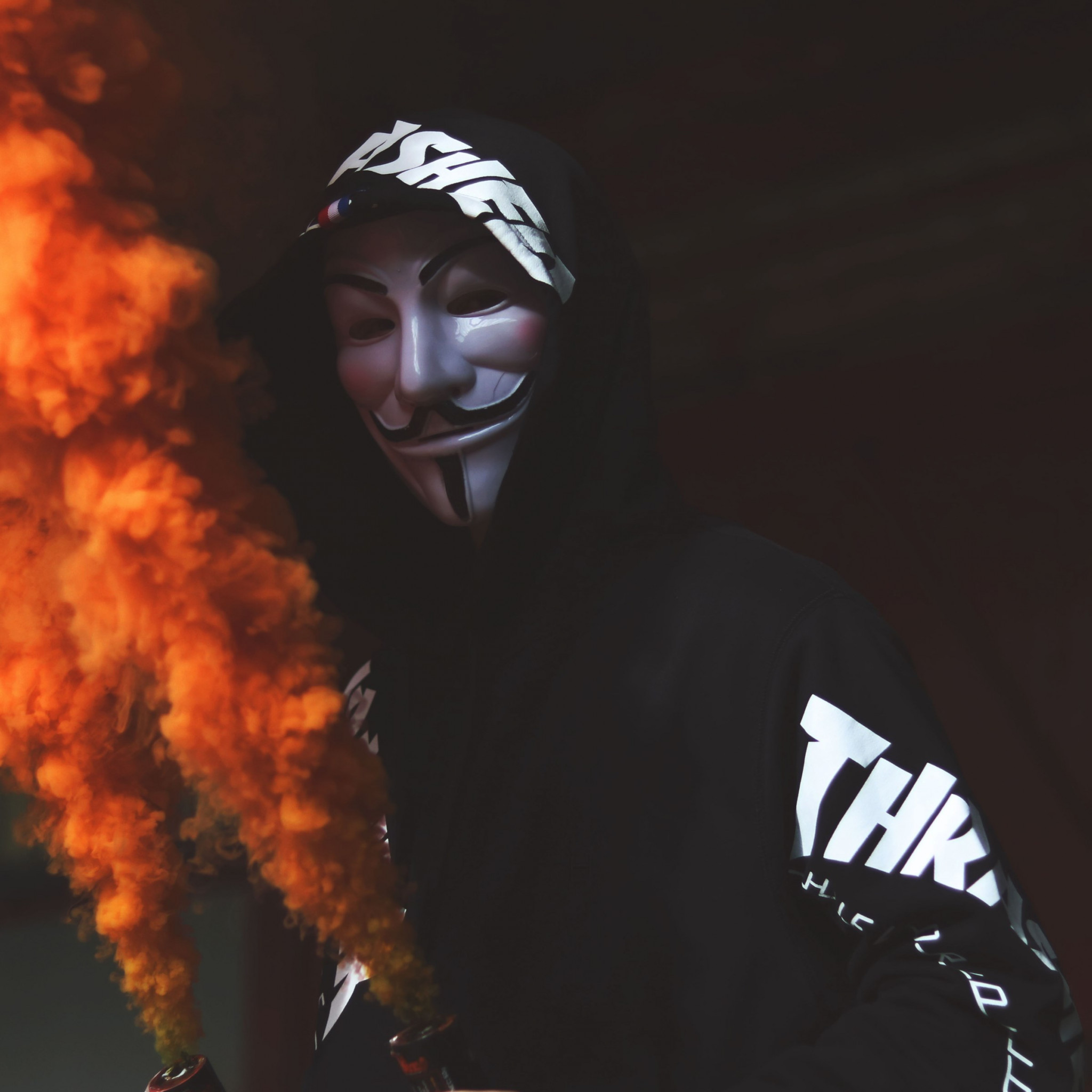 Anonymous mask and orange smoke wallpaper 2048x2048
