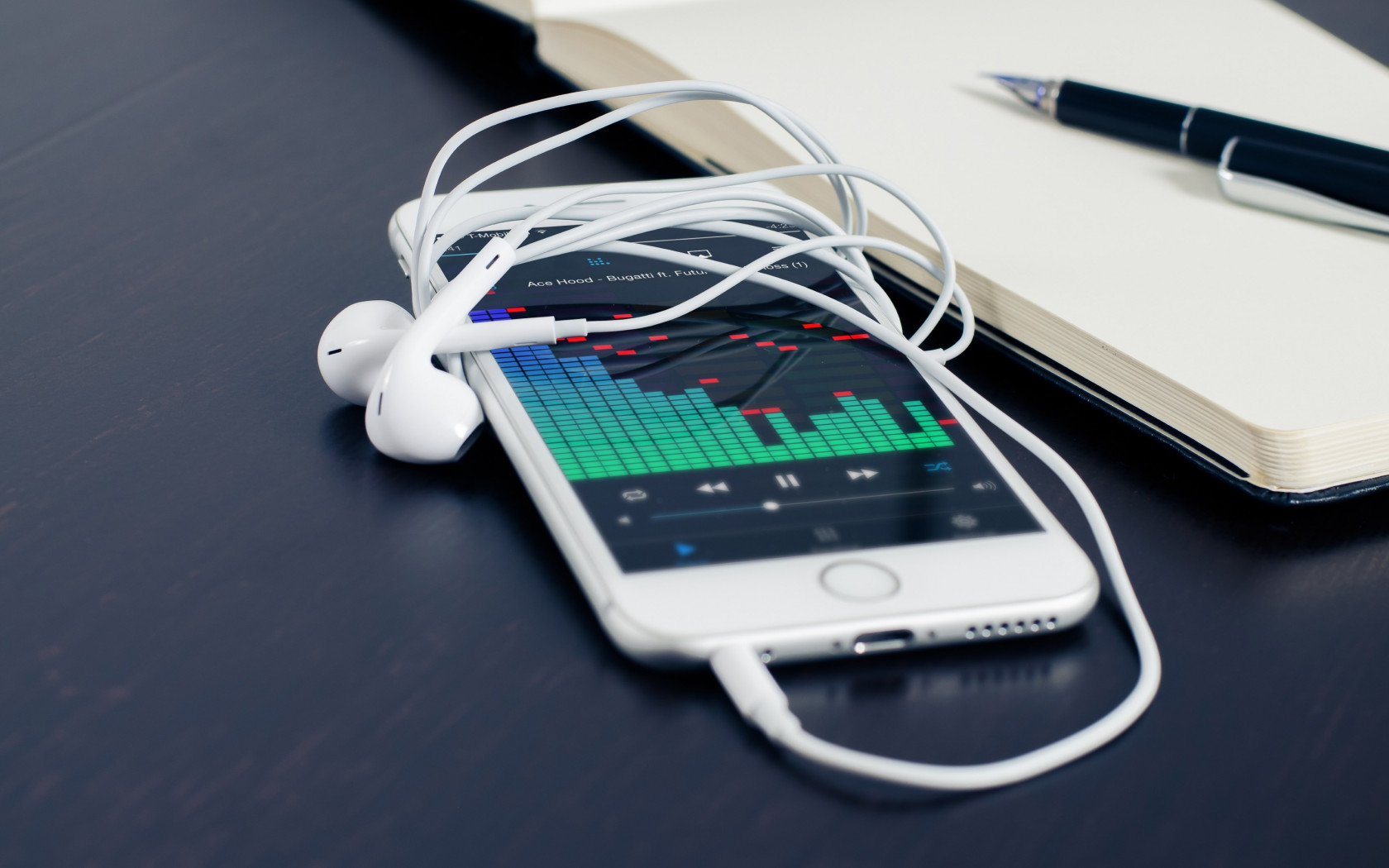 Music plays on the iPhone's earphones wallpaper 1680x1050