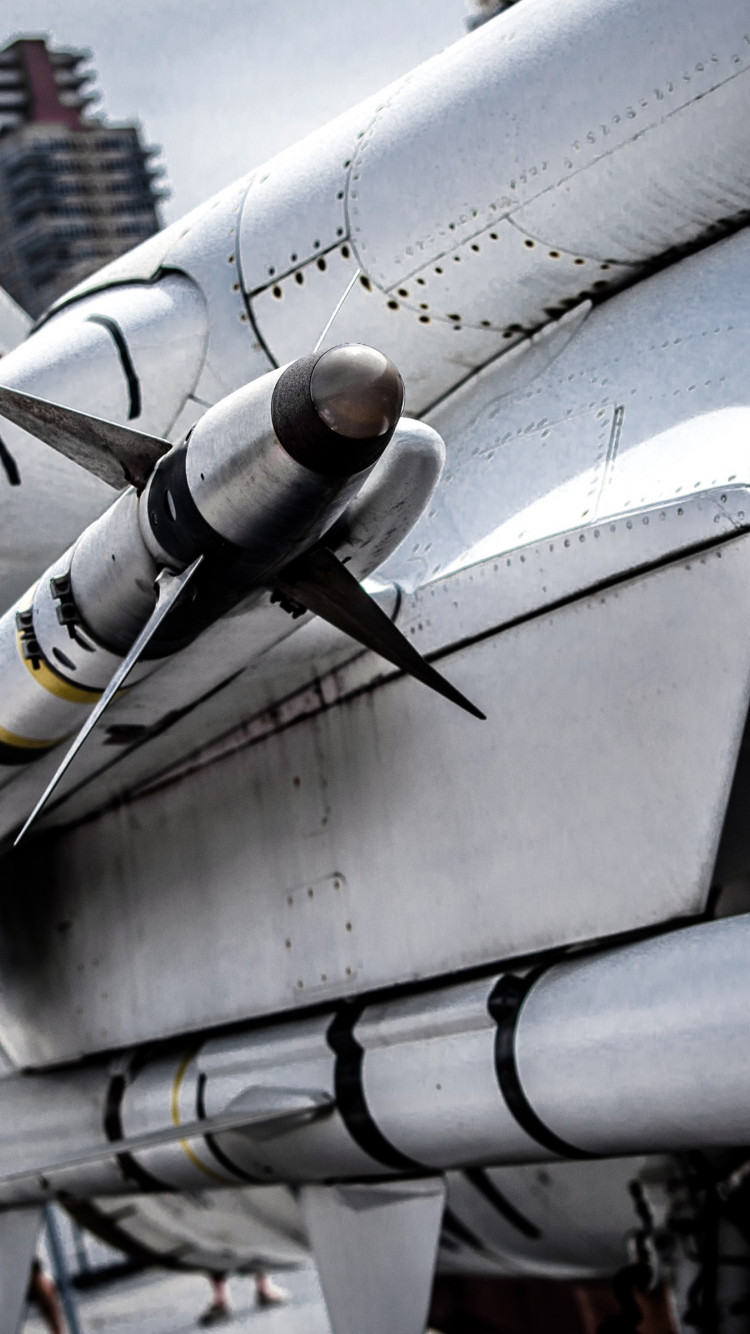Rocket on the fighter aircraft wallpaper 750x1334