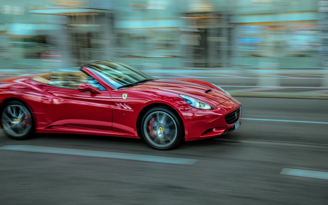 Ferrari in motion wallpaper 1280x800