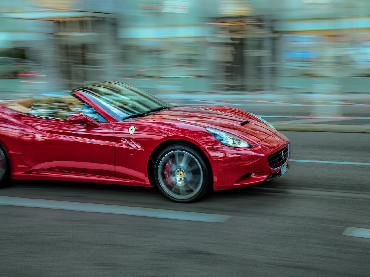 Ferrari in motion wallpaper 1280x960