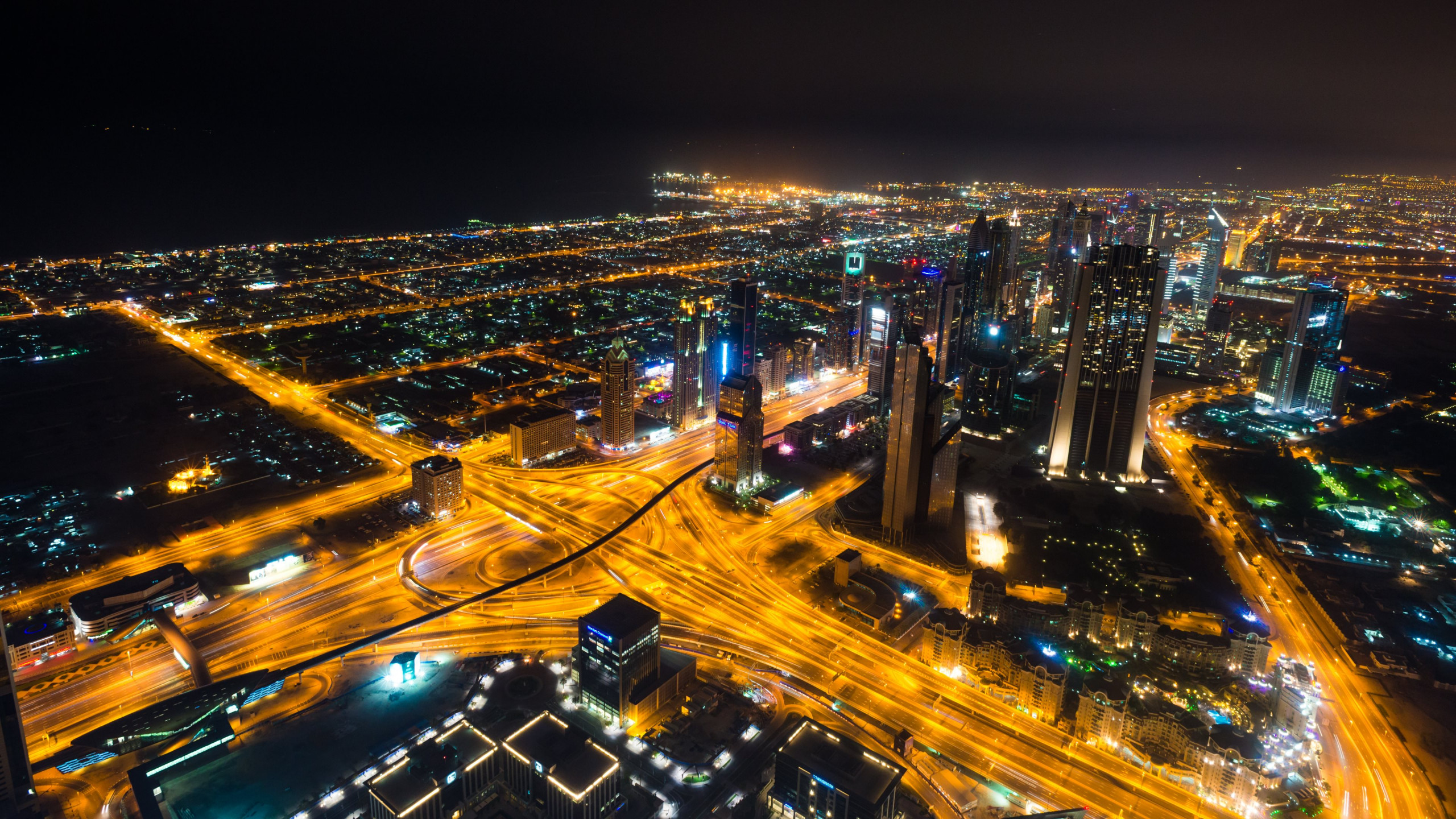 Download wallpaper: Dubai landscape by night 2560x1440