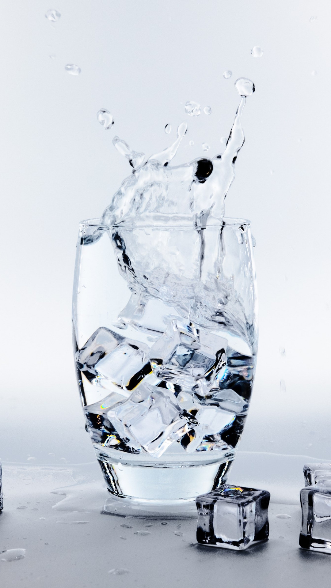 Water glass with ice cubes wallpaper 1080x1920