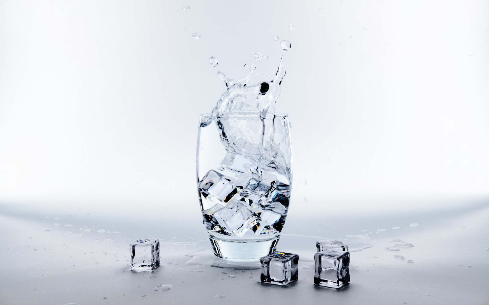 Water glass with ice cubes wallpaper 1680x1050