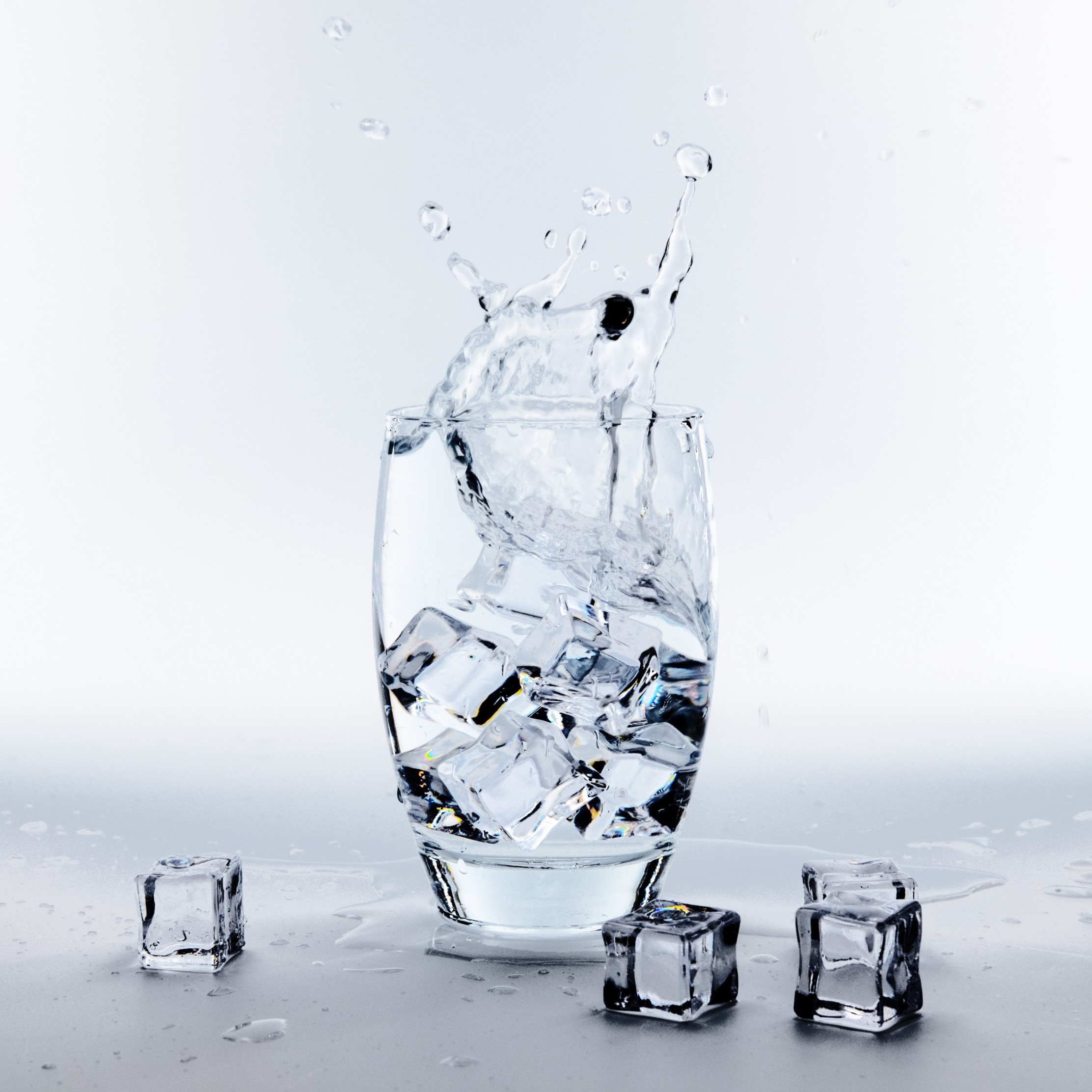 Water glass with ice cubes wallpaper 2224x2224