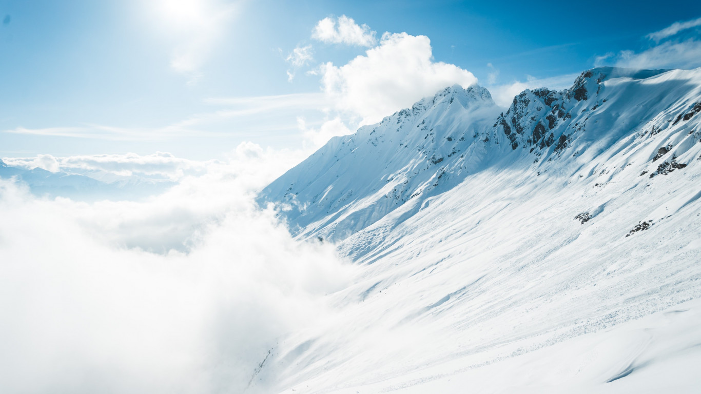 Mountains full of snow and blue sky wallpaper 1366x768