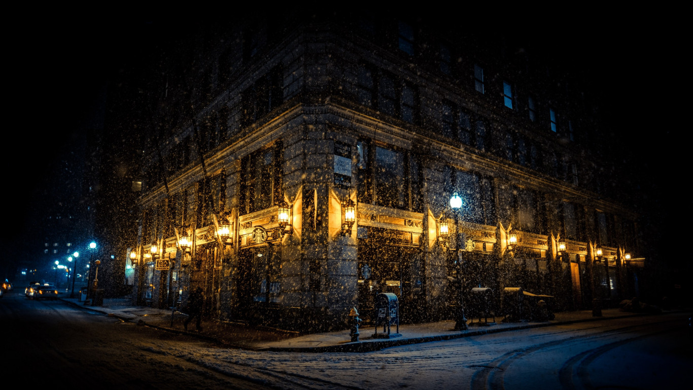 Snowing on the city streets wallpaper 1366x768