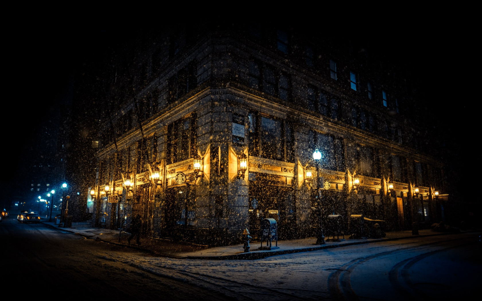 Snowing on the city streets wallpaper 1680x1050