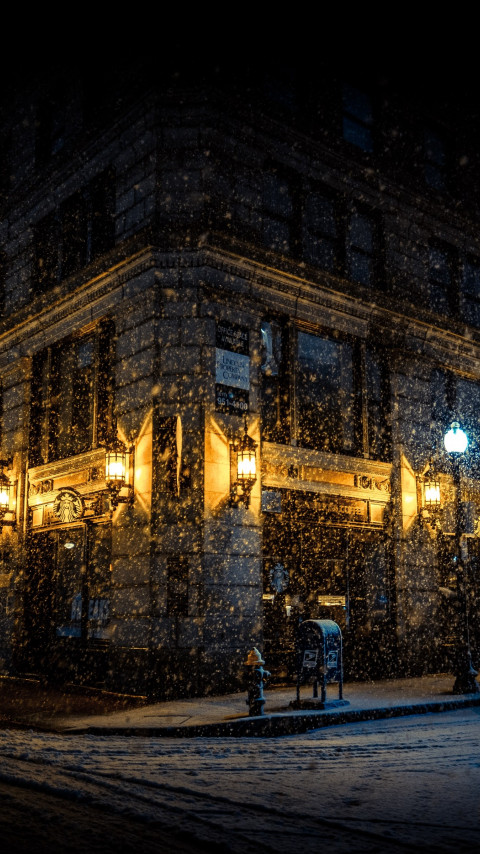 Snowing on the city streets wallpaper 480x854