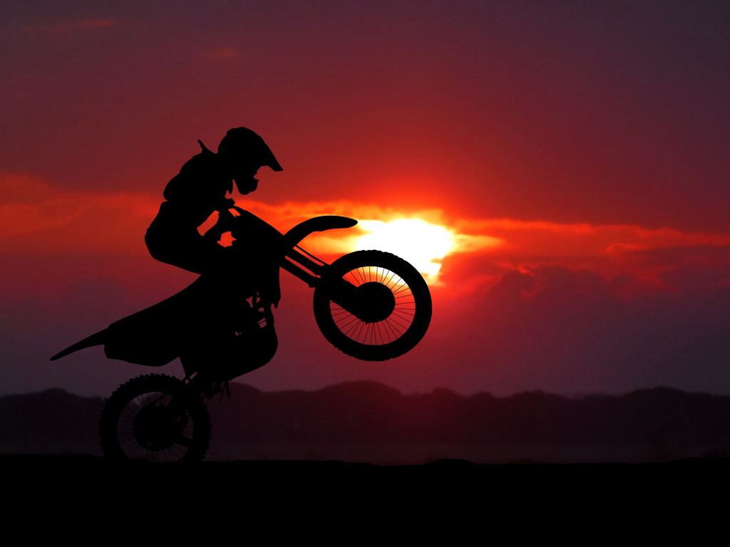 Biker on motorcycle at sunrise wallpaper 1024x768