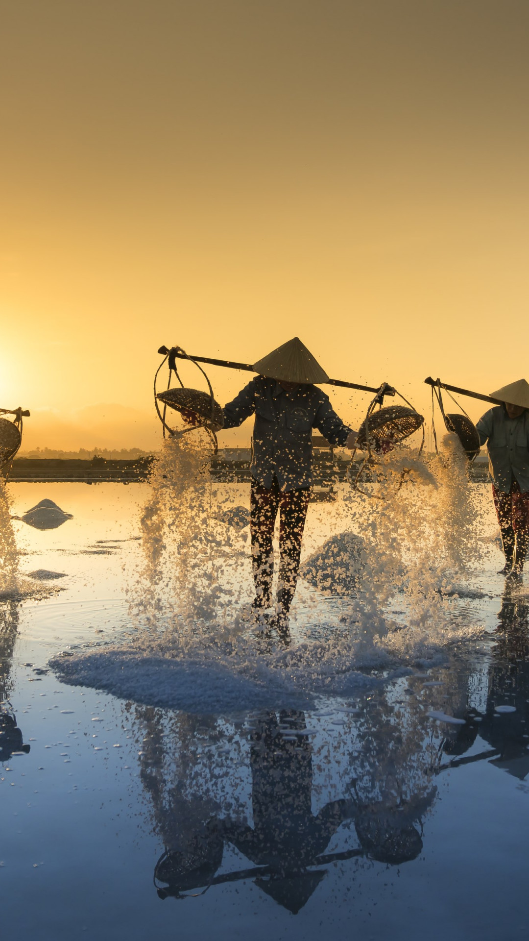 People harvesting salt in Vietnam wallpaper 1080x1920