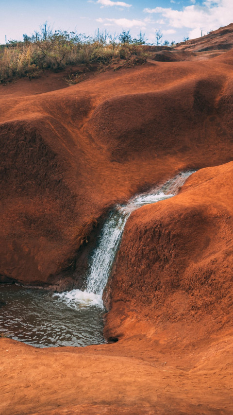 Waterfall in the arid landscape wallpaper 480x854