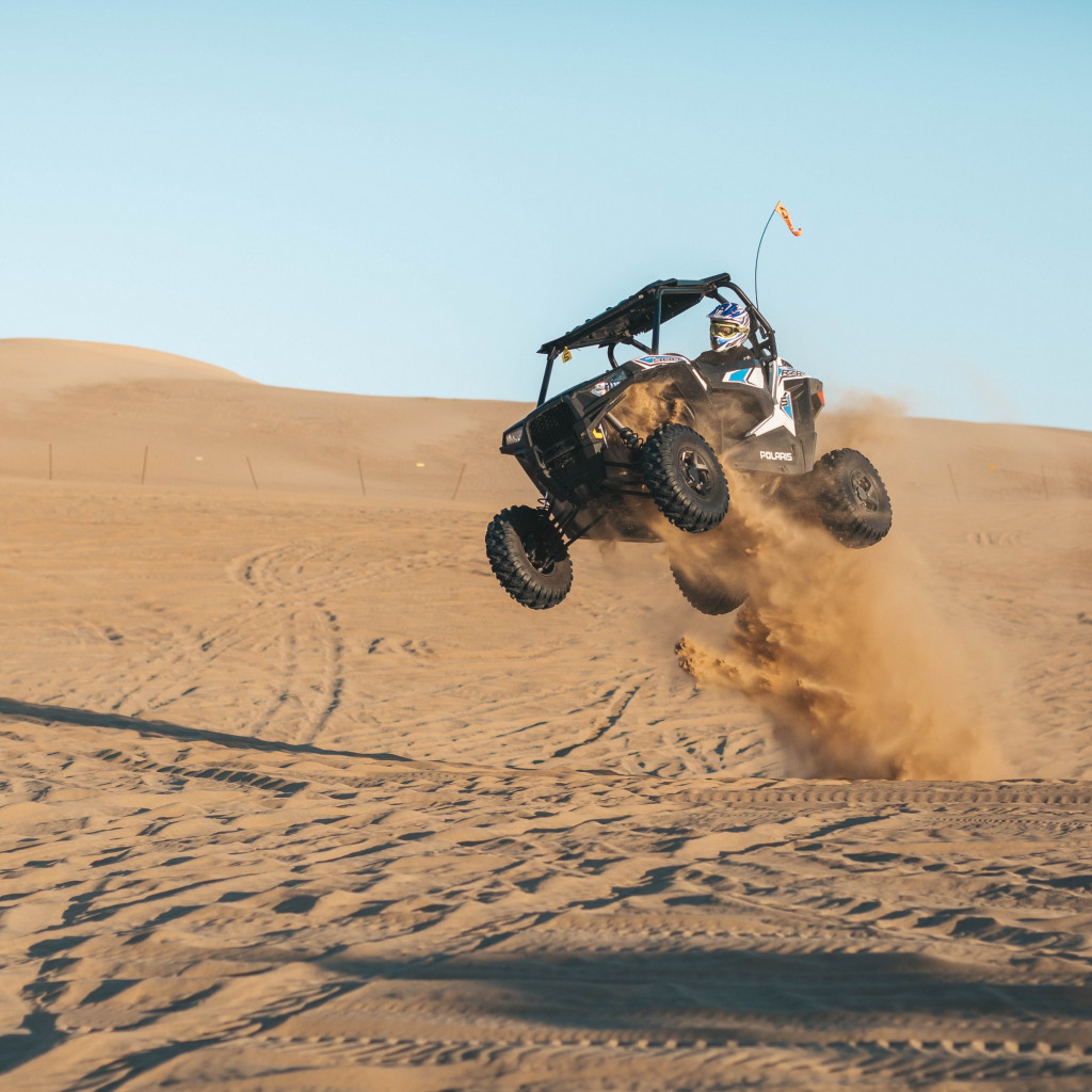 With ATV on the the sand dunes wallpaper 1024x1024
